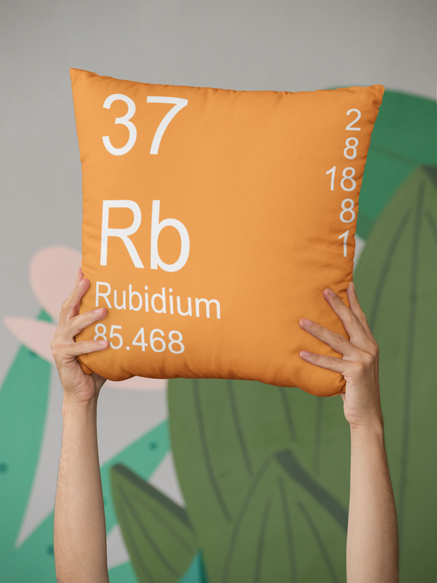 Orange Rubidium Element Pillow in Hands