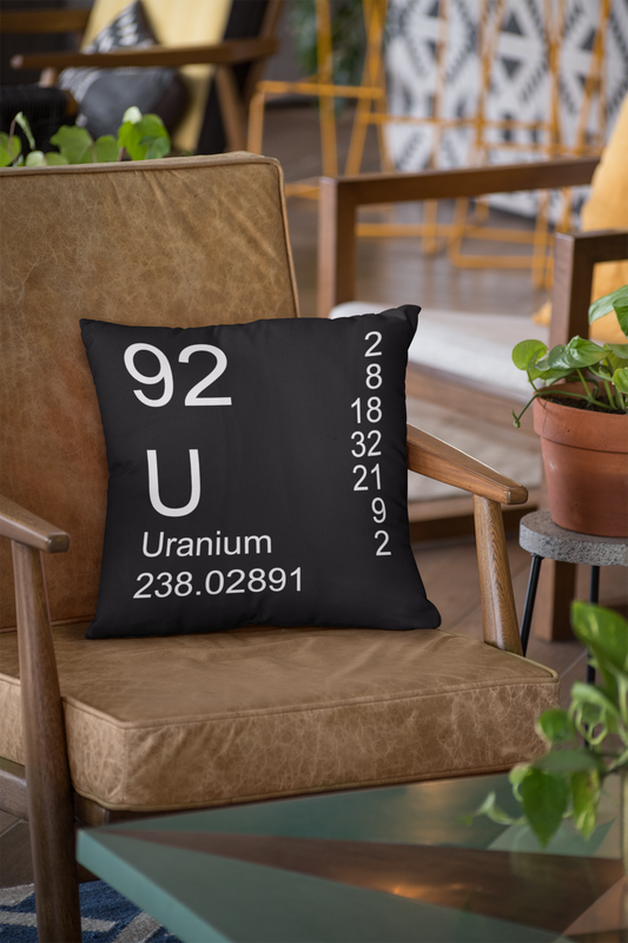 Black Uranium Element Pillow on Leather Chair