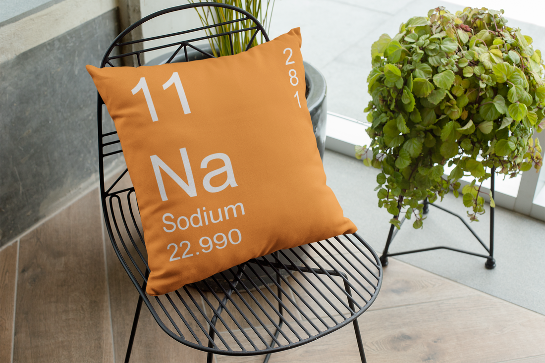 Orange Sodium Element Pillow on Metal Chair