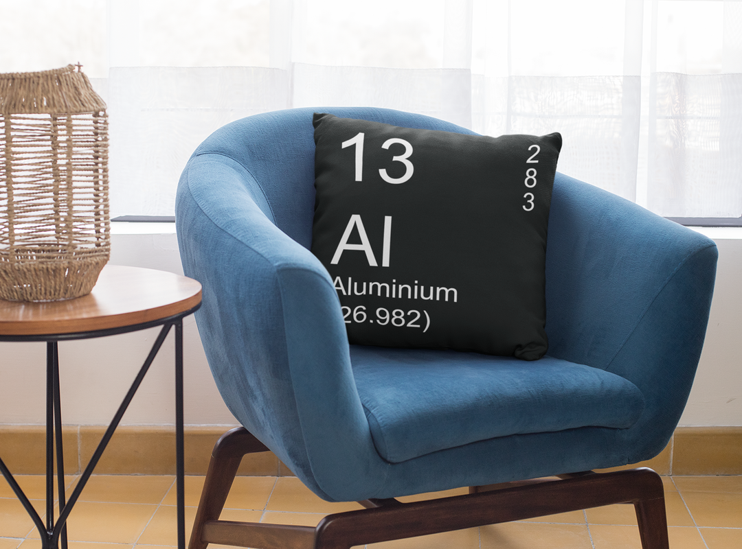 The Periodic table of elements pillow  - Black Aluminium Element Pillow on Blue Chair