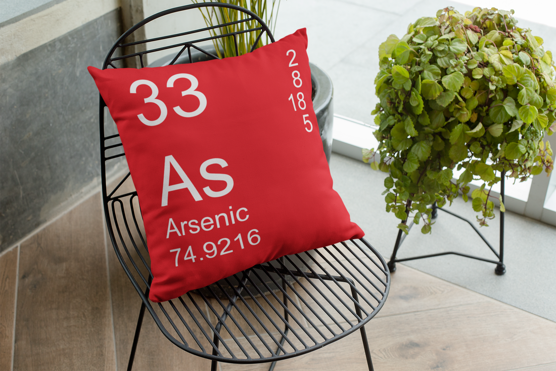 Red Arsenic Element Pillow on a Chair
