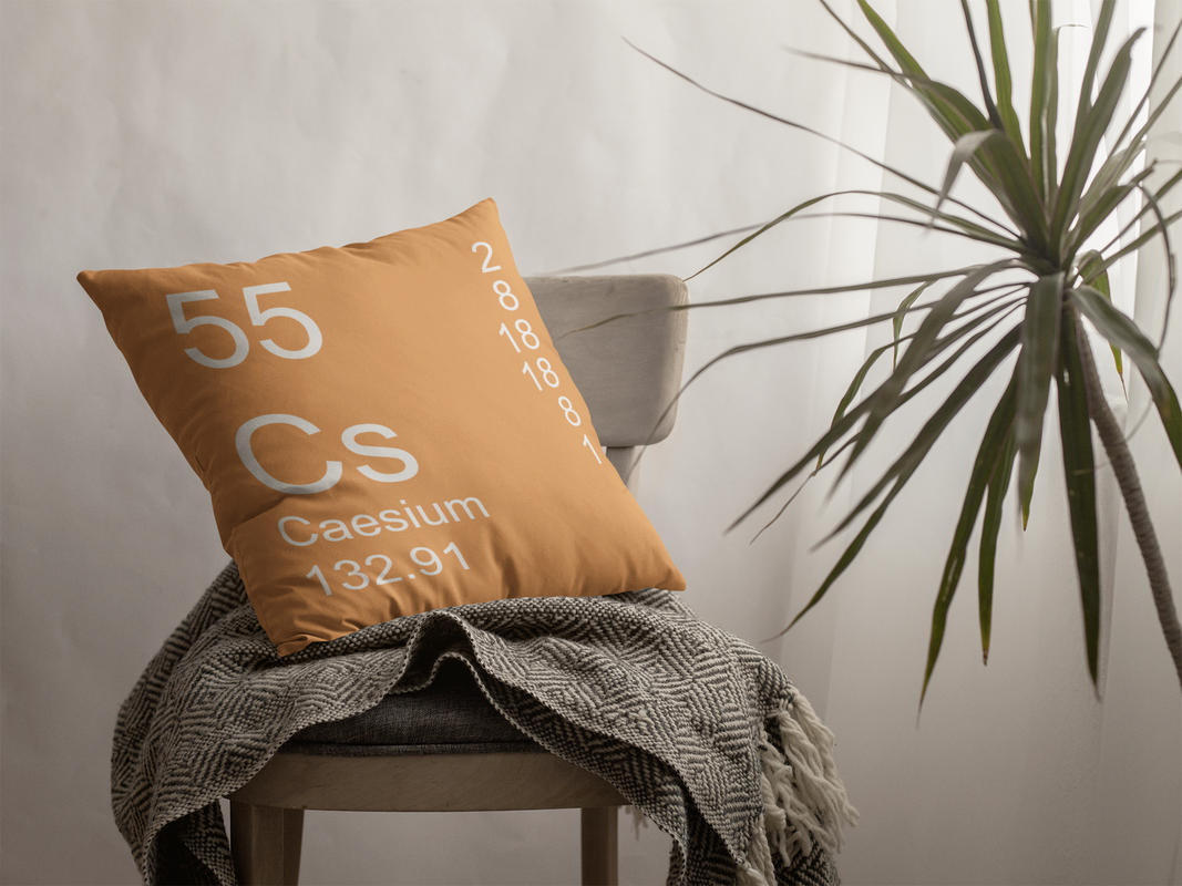 Soft Orange Caesium Element Pillow on Chair
