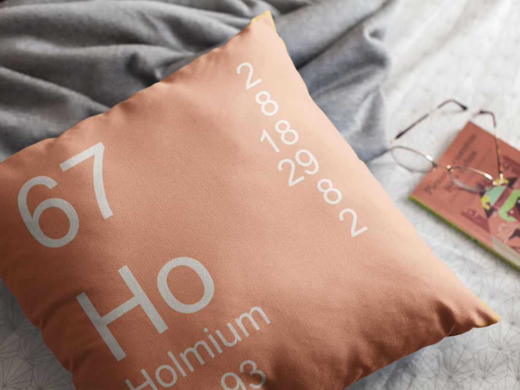 Peach Holmium Element Pillow on Bed