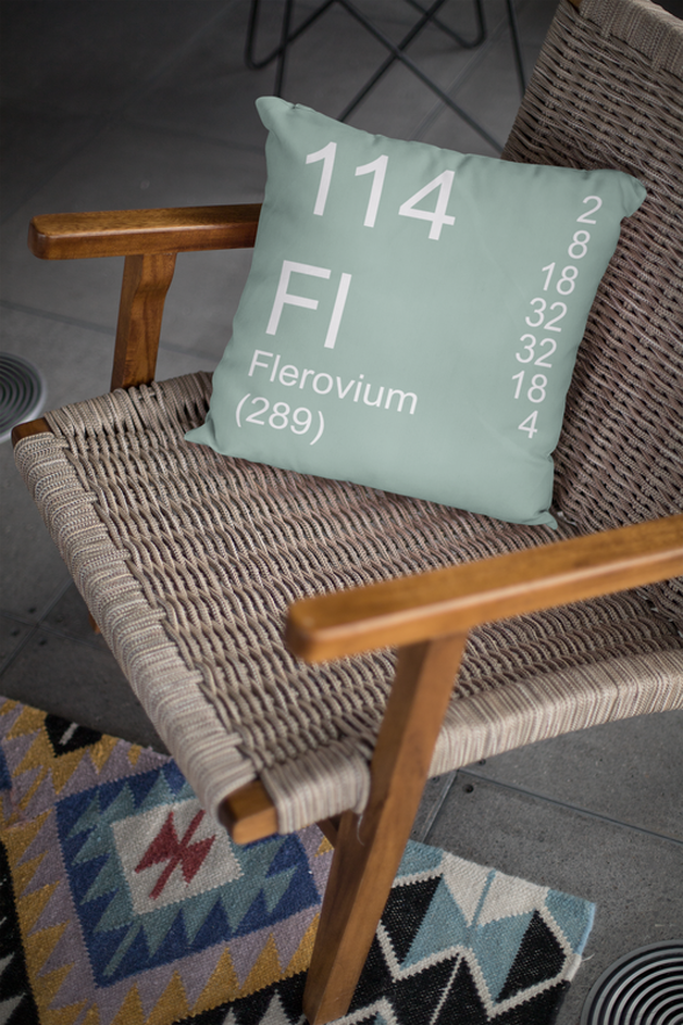 Sage Green Flerovium Element Pillow on Woven Chair