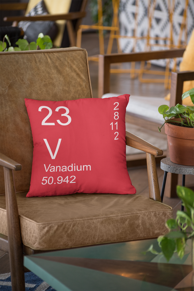 Red Vanadium Element Pillow on Leather Chair
