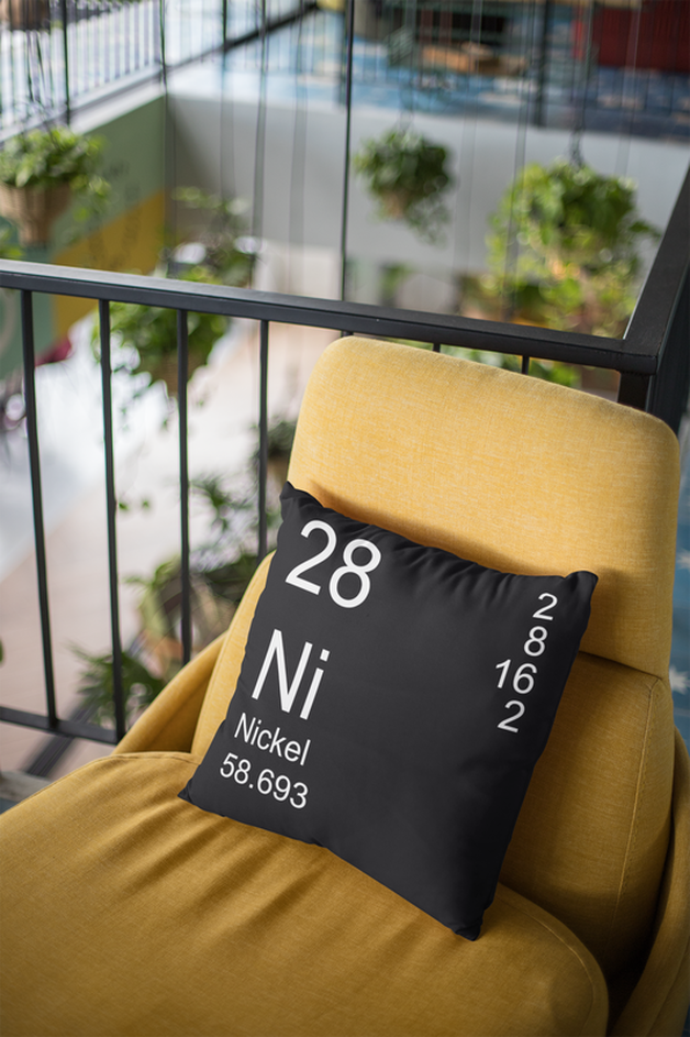 Black Nickel Element Pillow on Orange Chair