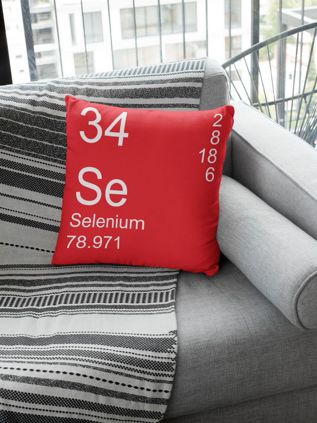 Red Selenium Element Pillow on Couch 