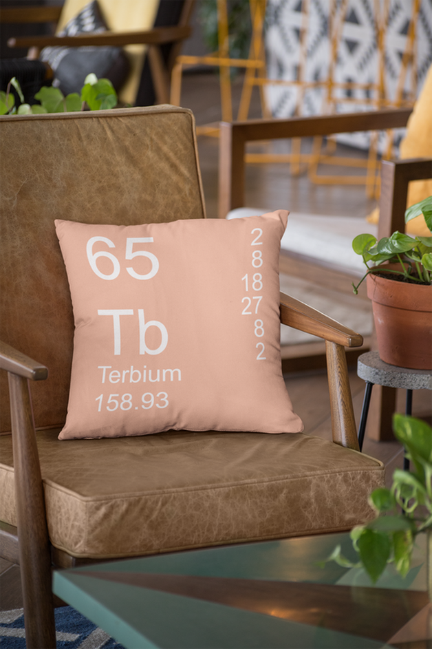 Peach Terbium Element Pillow on Leather Chair