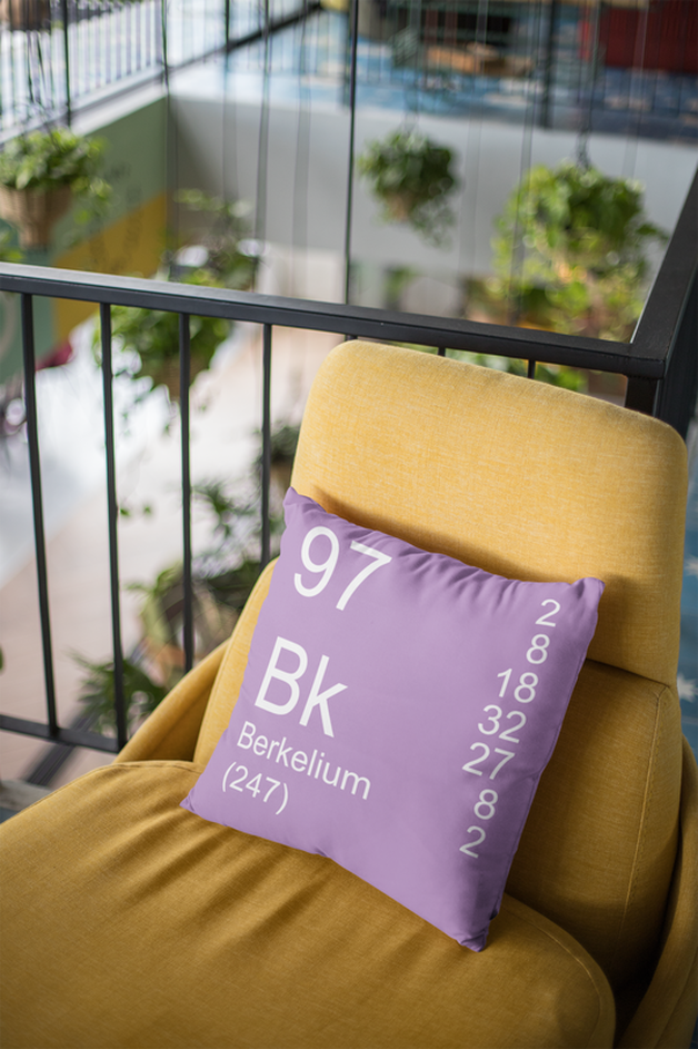 Lilac Berkelium Element Pillow on Orange Chair
